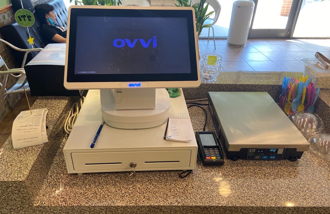 Point-of-sale system and payment terminal installed at a merchant counter