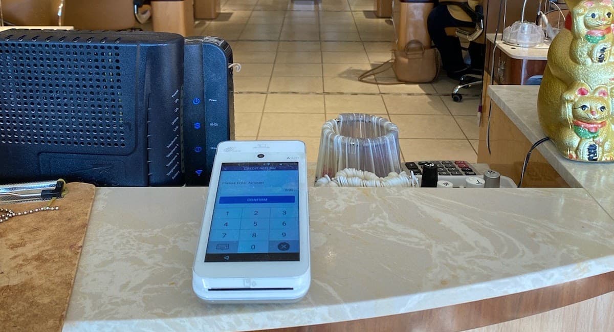 Payment terminal installed at a salon reception counter