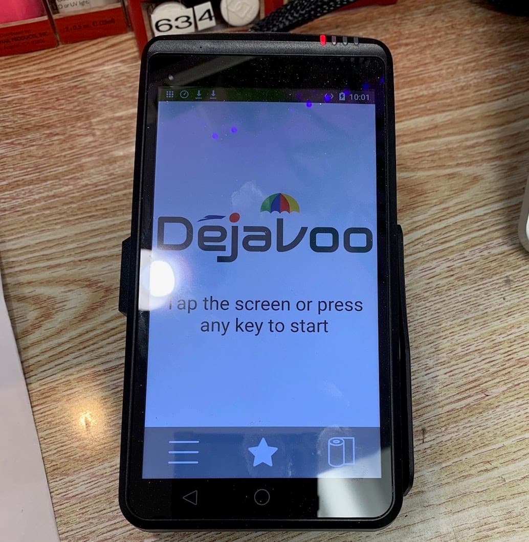 Portable touchscreen payment terminal on a merchant counter